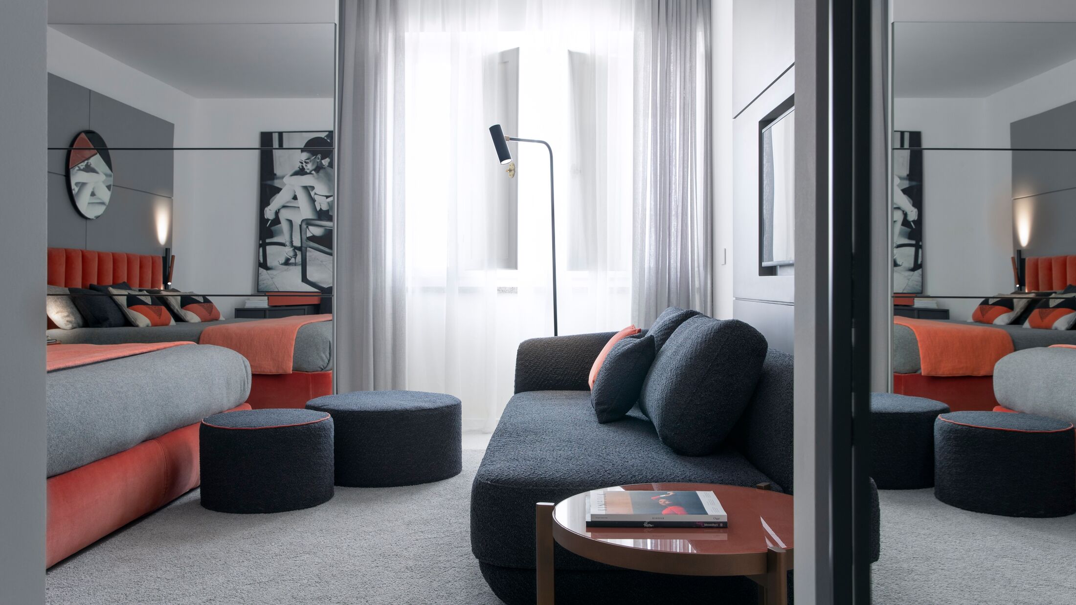 a living room filled with furniture and a large window