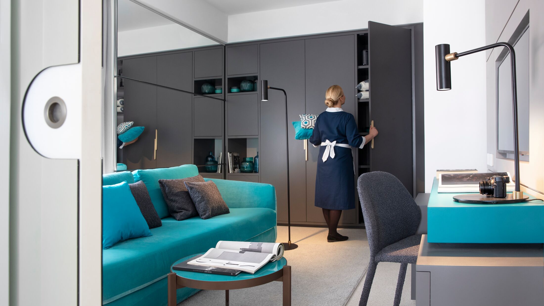 a person in a blue chair in a room