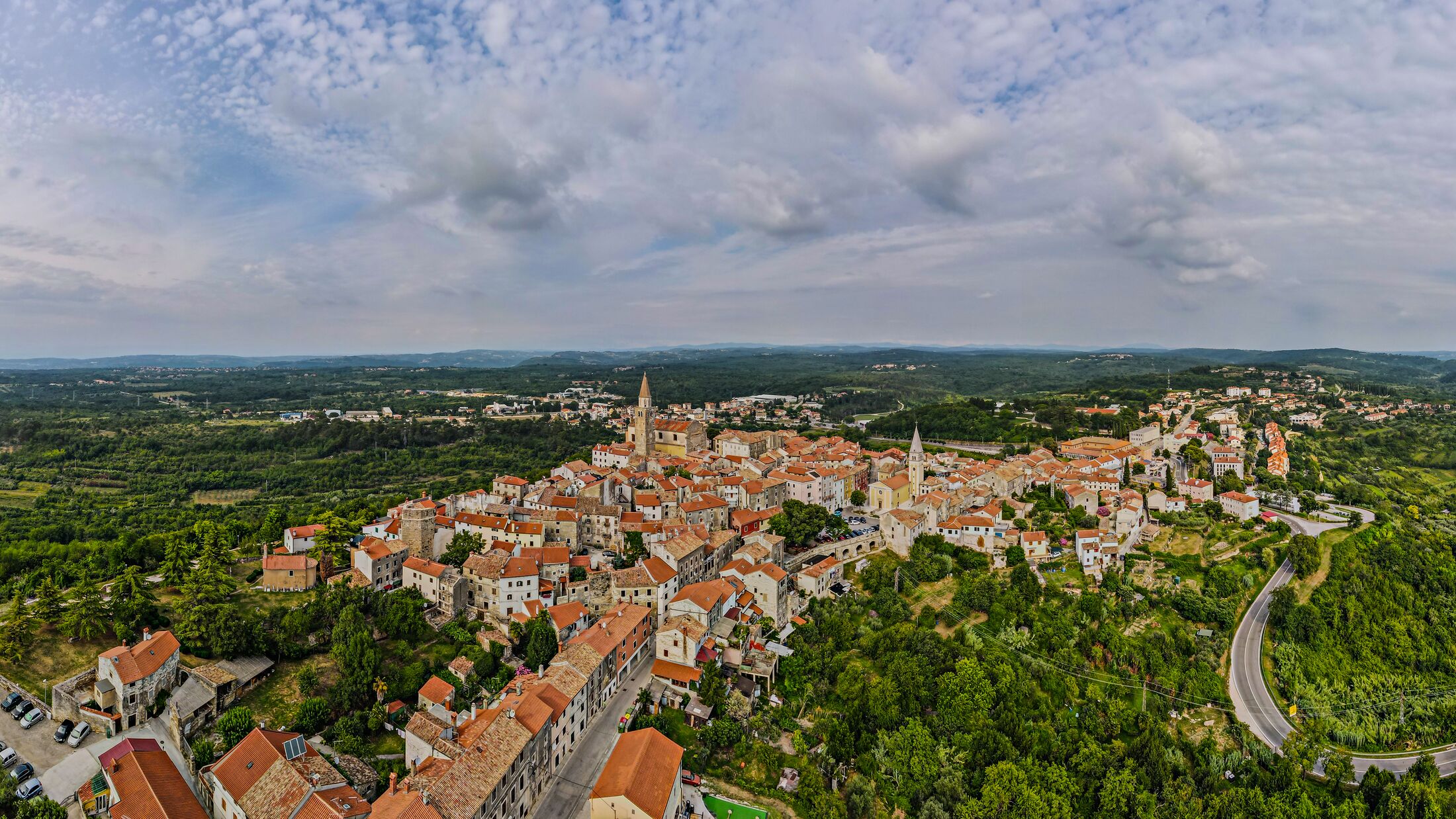 Buje city from above in Istria, Croatia, aerial panoramic shot in summer sunny day.