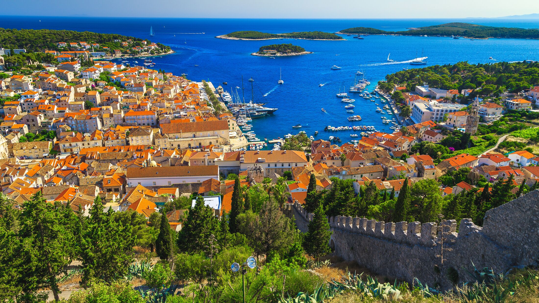 Amazing view from the Spanjola fortress garden with Hvar harbor and green islands in background, Hvar island, Dalmatia, Croatia, Europe
