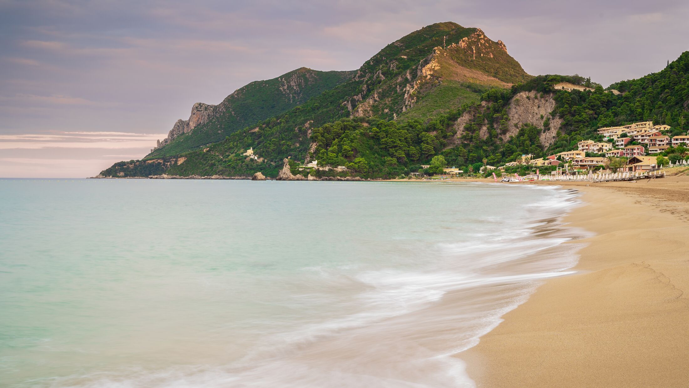 Sunrise on Glyfada beach in Corfu, Greece..
