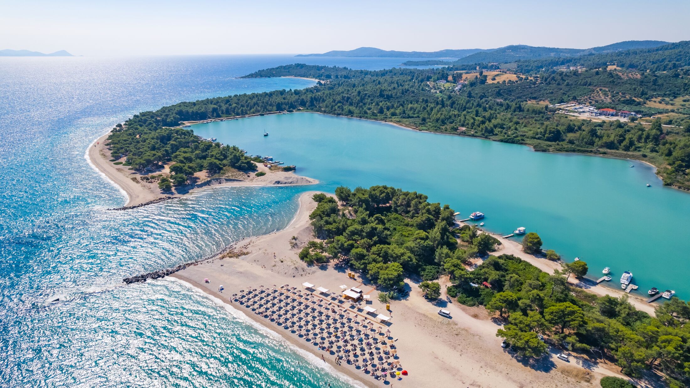 scenic drone shot of stunning Glarokavos Beach in Kassandra peninsula, Halkidiki, Greece. High quality photo