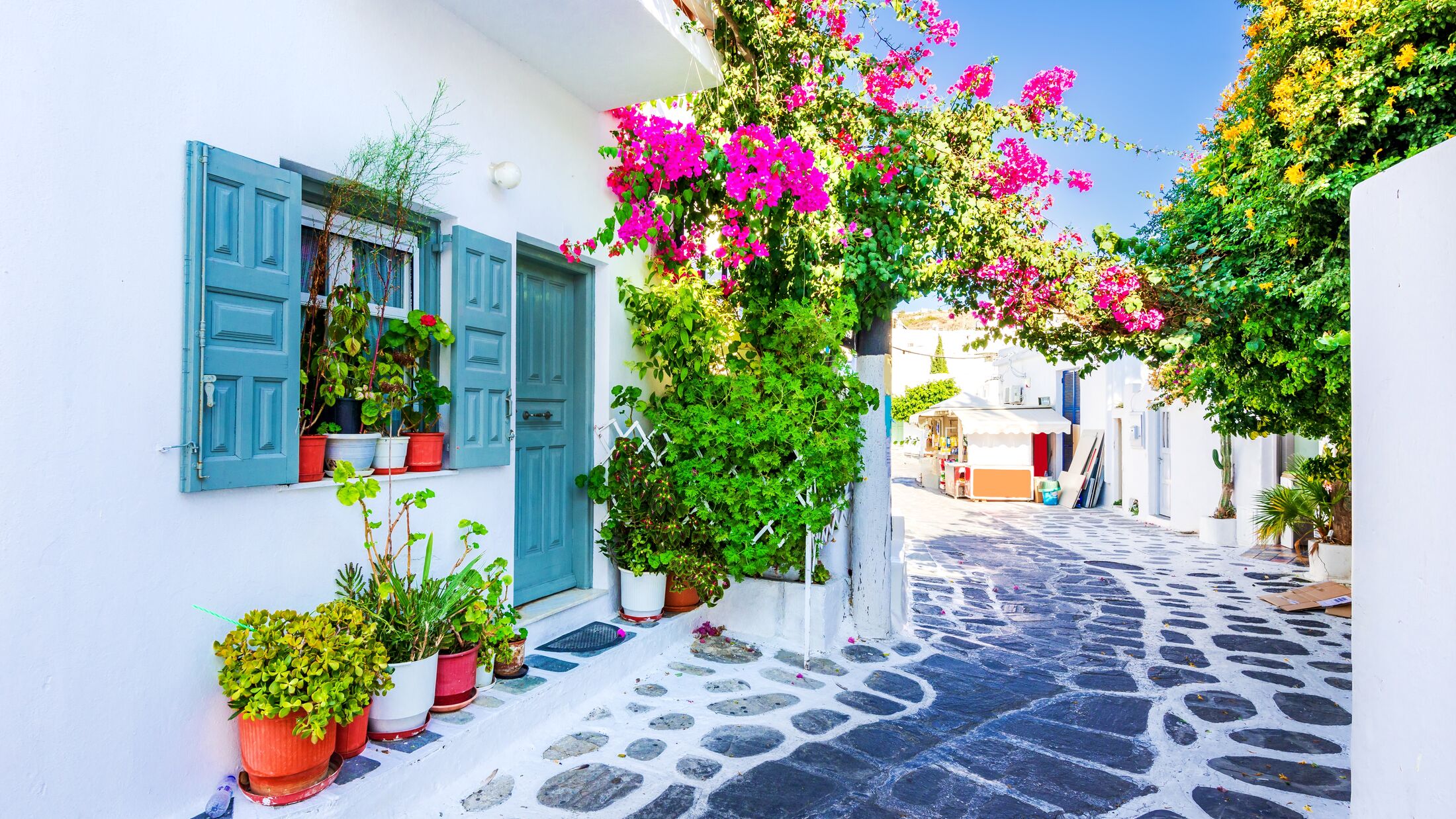 Mykonos, Greece. Whitewashed dotted alley in old city Little Venice, Cyclades Greek Islands.