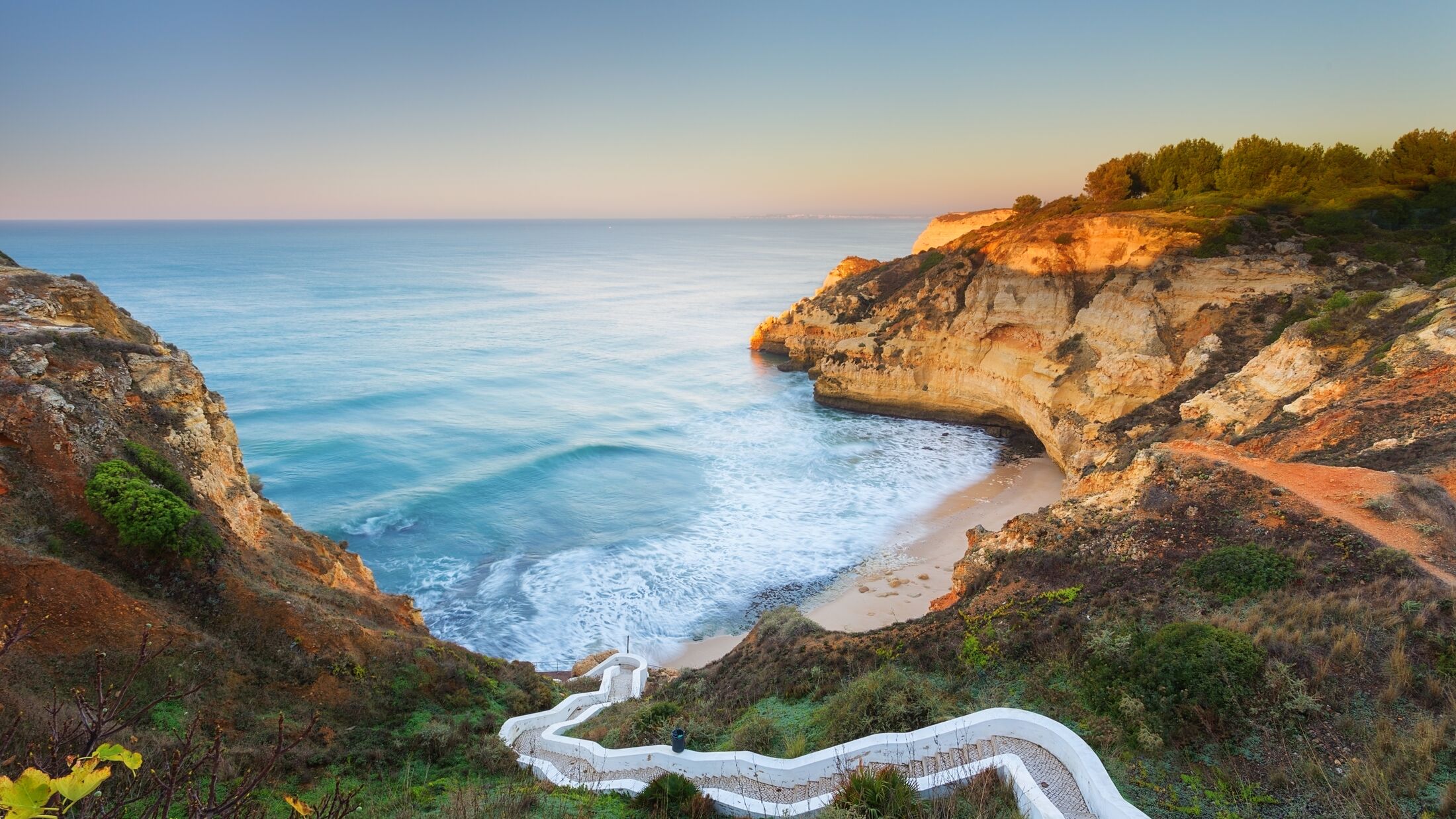 Beautiful seascape bay with serpentine steps. Portugal, Carvoeiro.