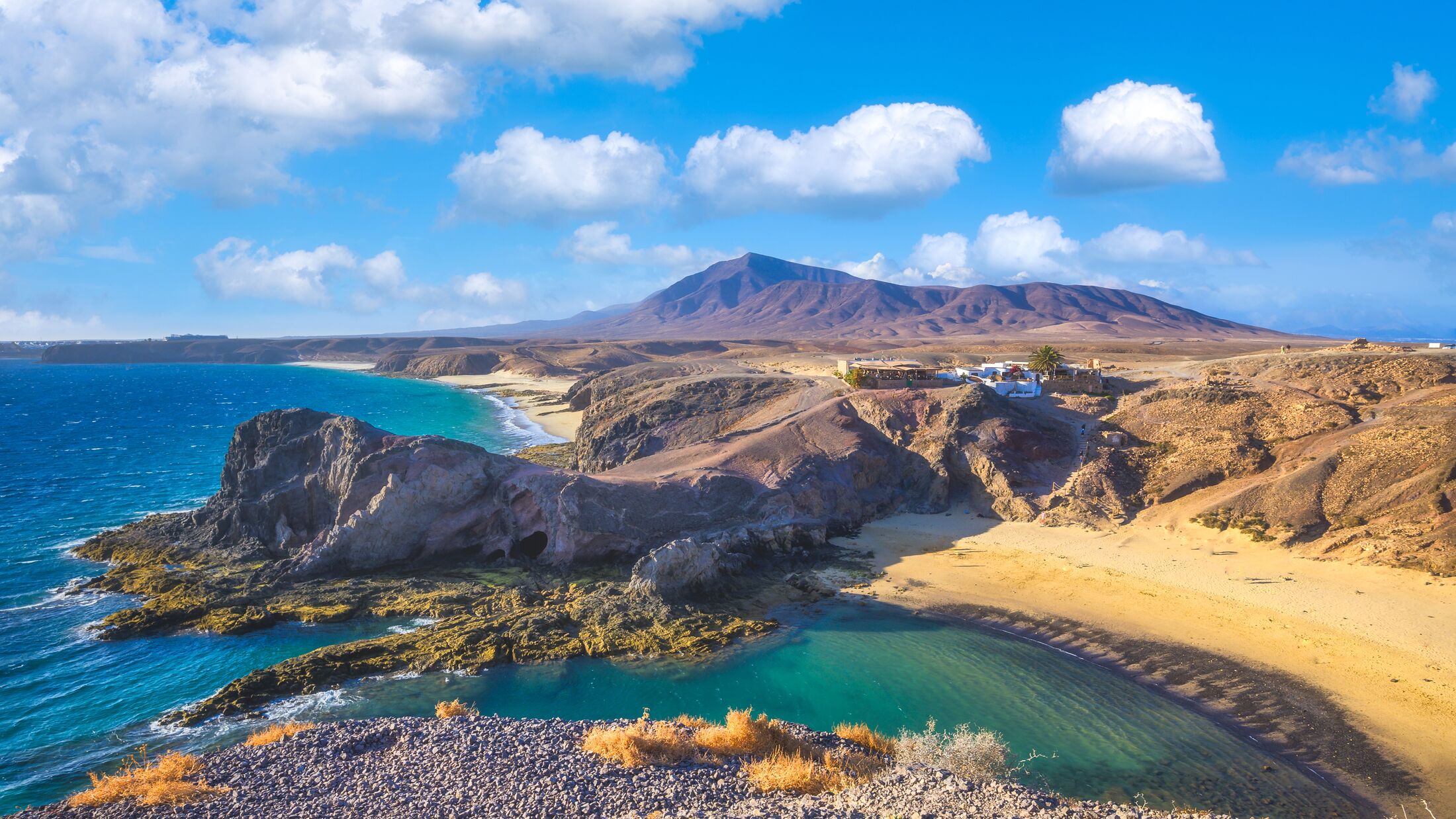Landscape with turquoise ocean water on Papagayo beach, Lanzarote, Canary Islands, Spain