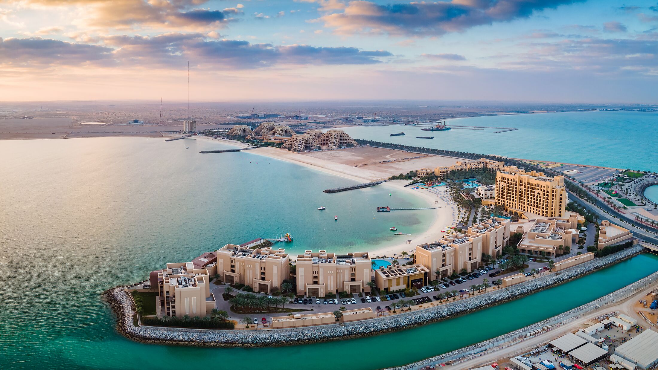 Panoramic view of Marjan Island seafront reclaimed land artificial island in emirate of Ras al Khaimah in the United Arab Emirates aerial view at sunrise