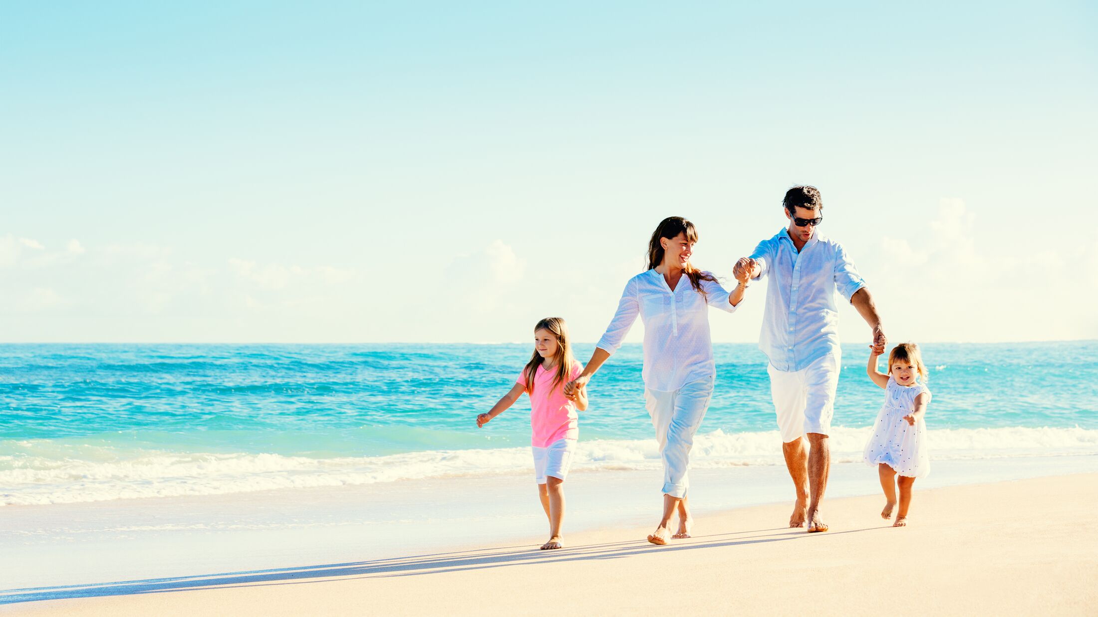 Happy Family Having Fun on Beautiful Sunny Beach