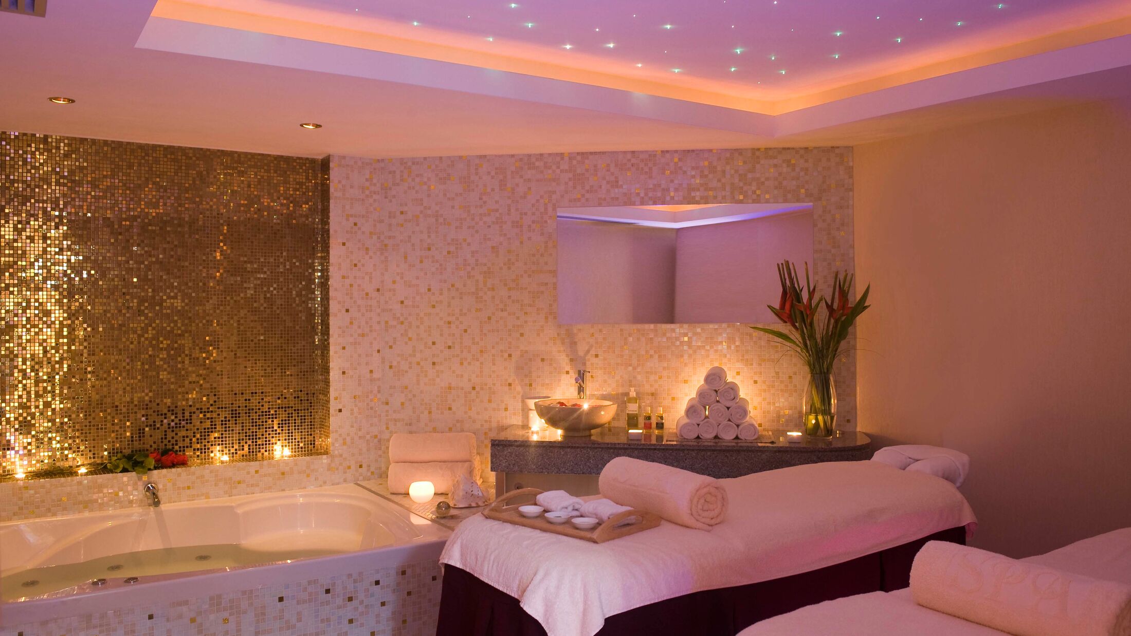 a bedroom with a large mirror
