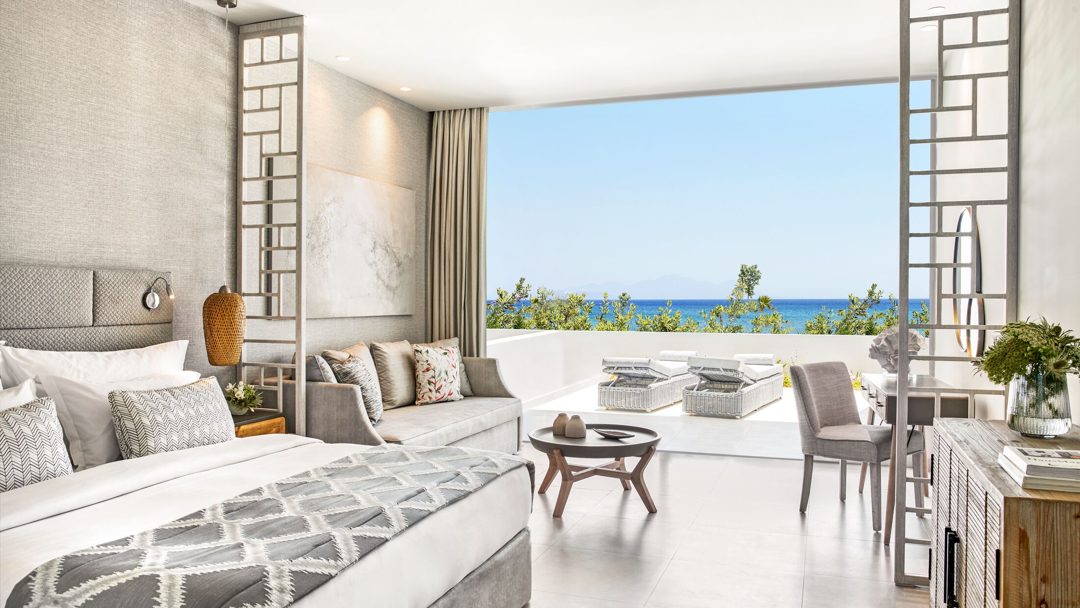 Ikos-Aria-2024-Deluxe-Junior-Suite-Private-Garden-Sea-View-001-121350-Hybris