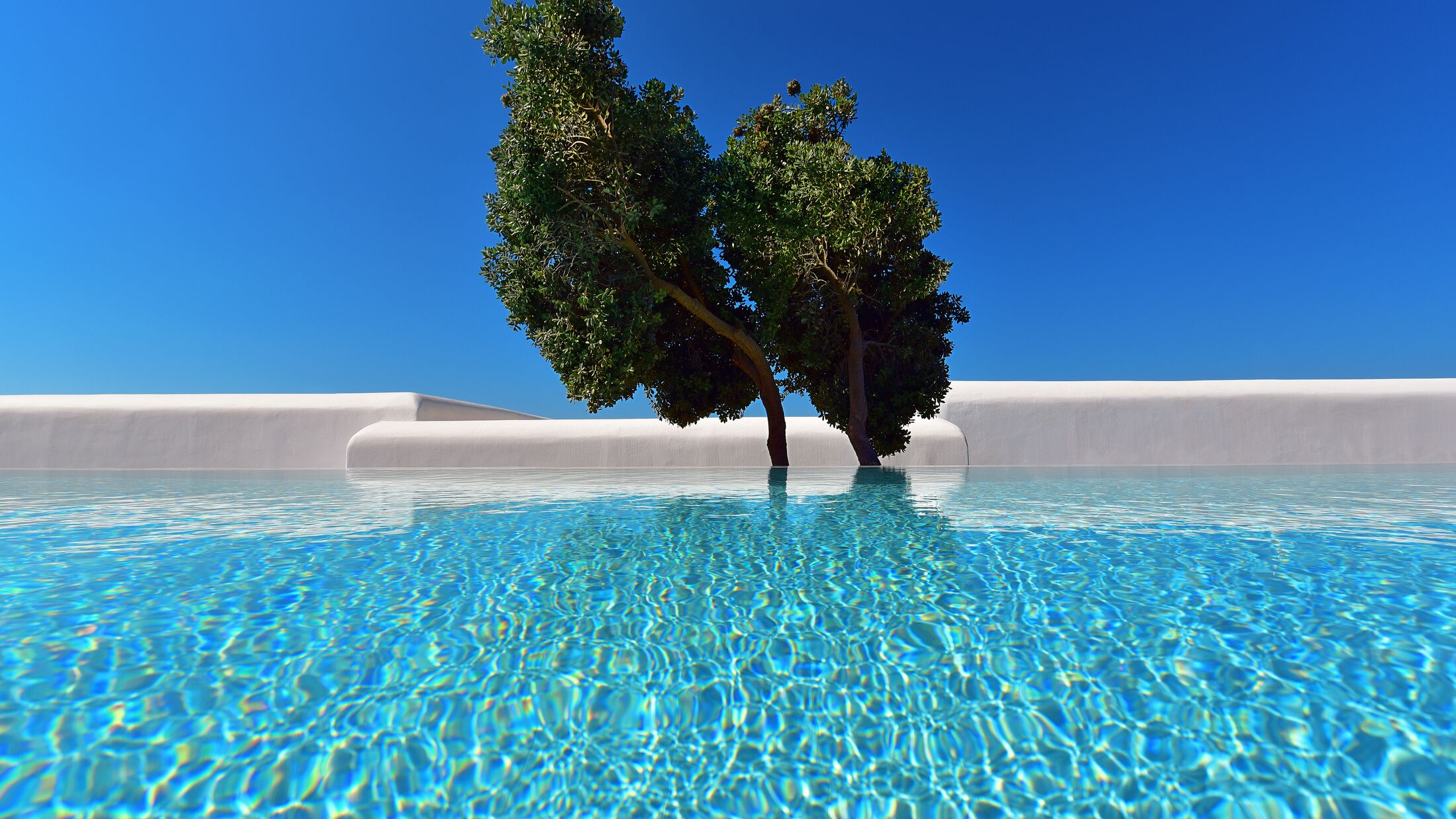 Mykonos-Grand-2022-Premium-Sharing-Pool-Room-001-121809-Hybris