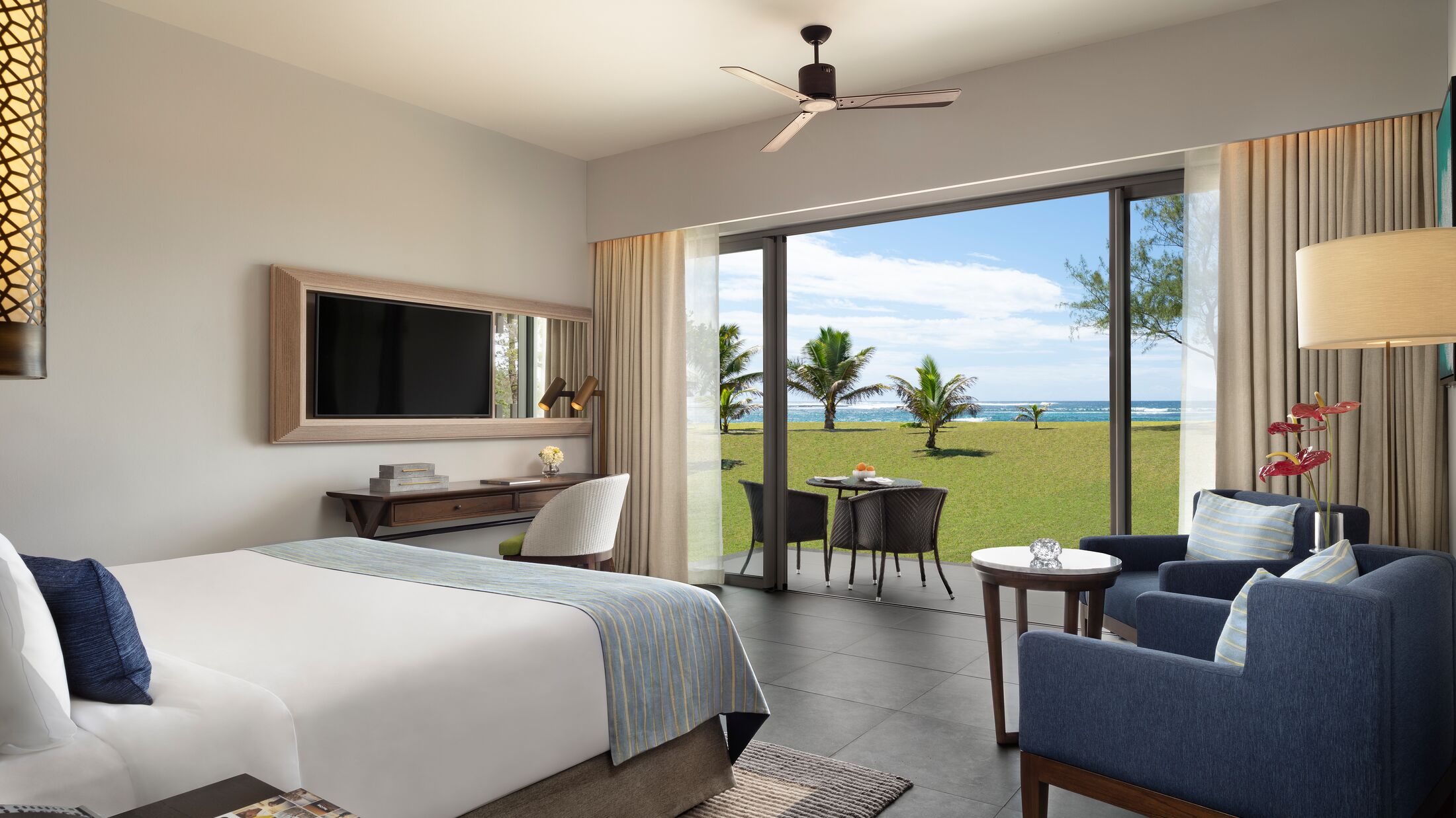 a living room filled with furniture and a large window