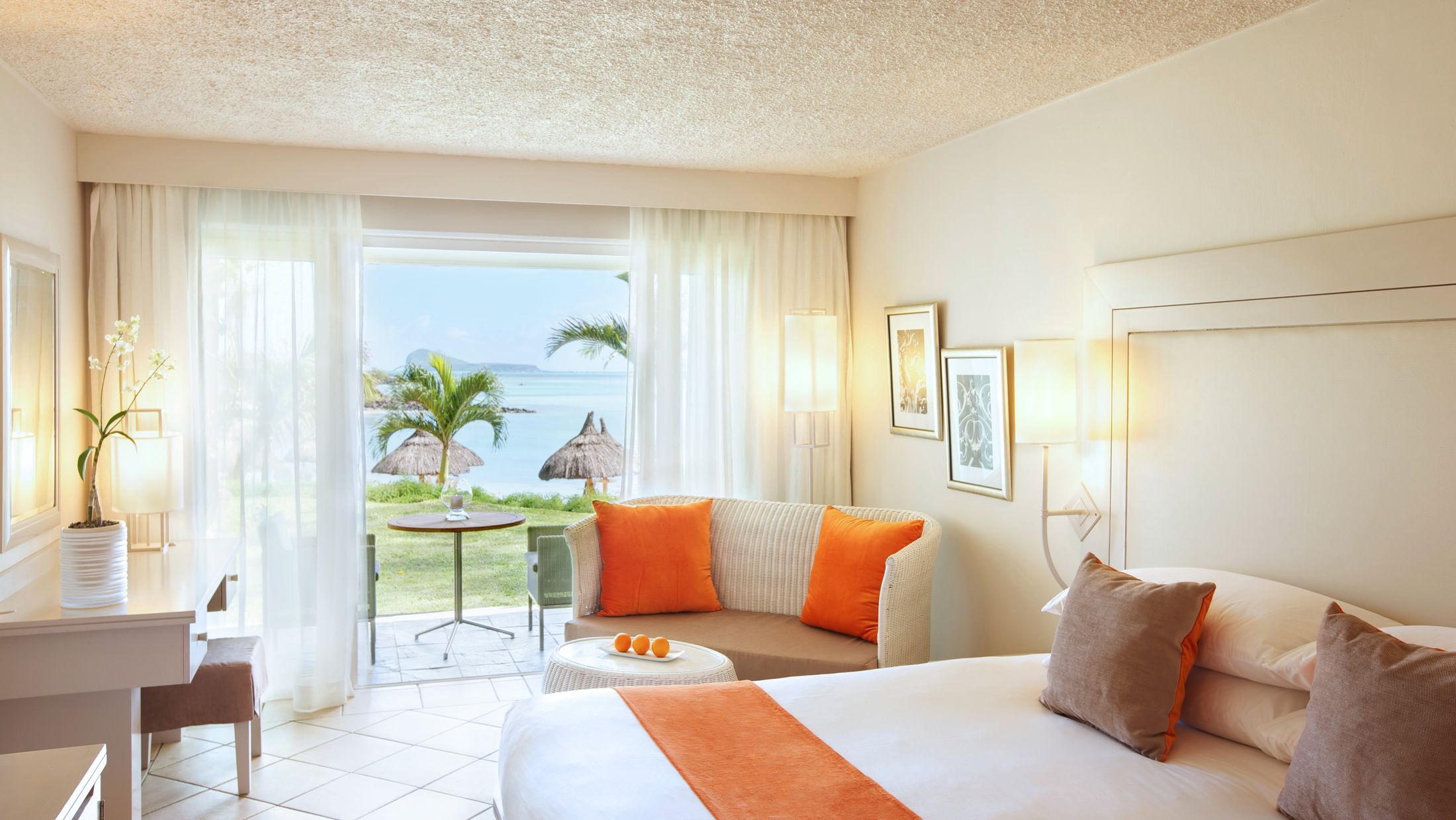 a bedroom with a large bed in a hotel room