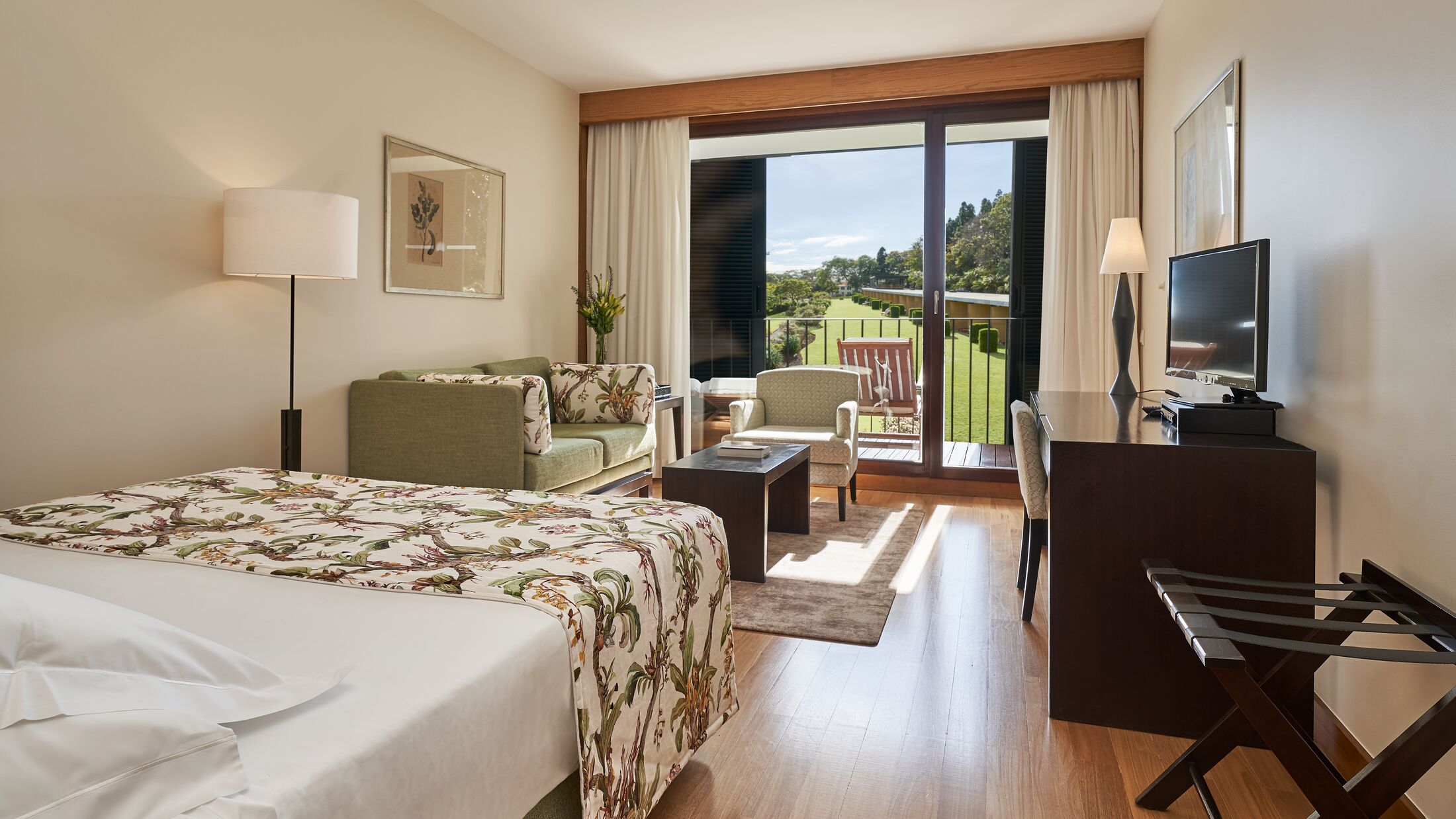 a bedroom with a large bed in a hotel room