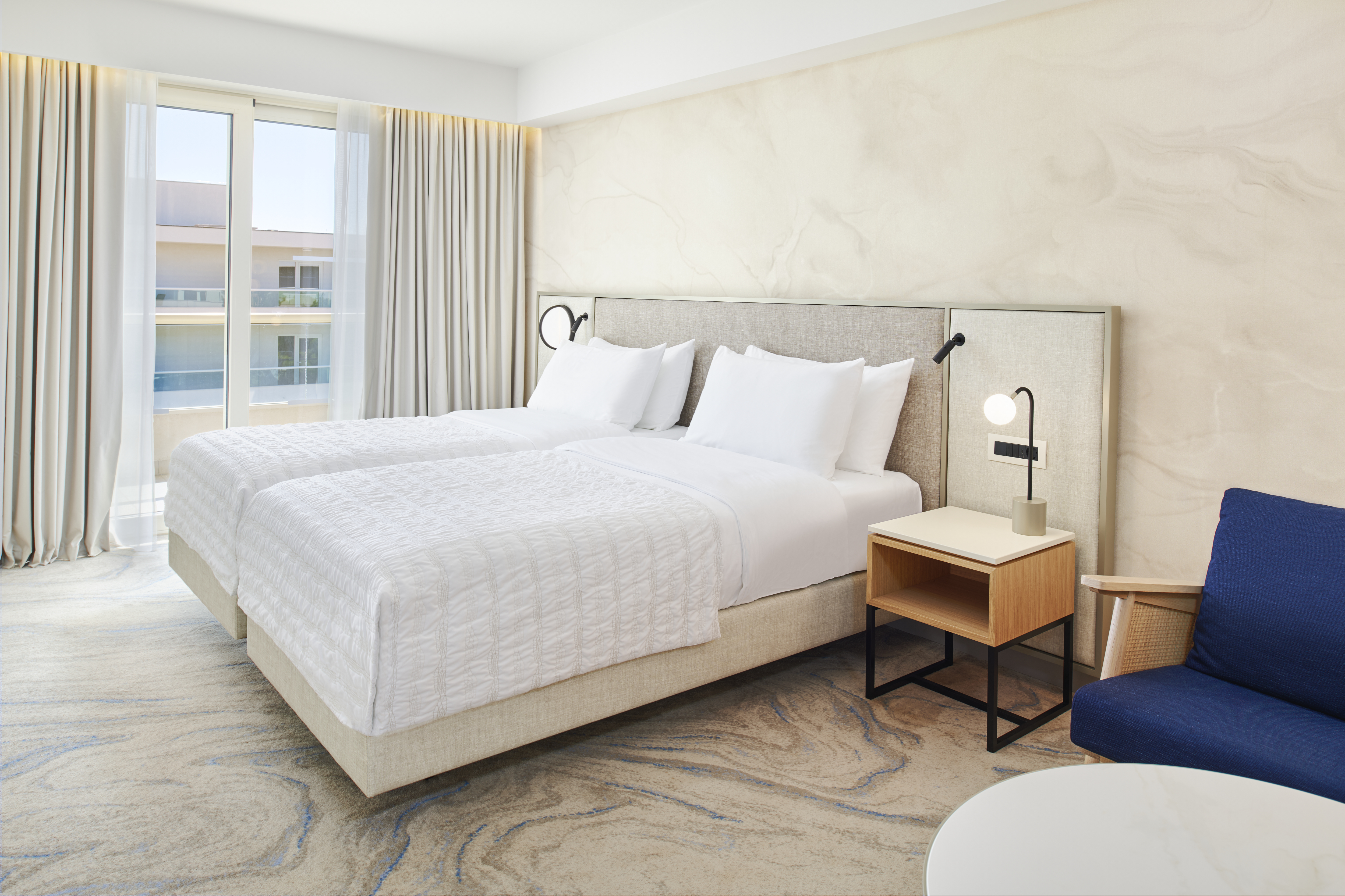 a bedroom with a bed in a hotel room