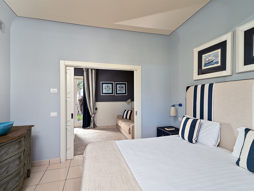 a bedroom with a bed in a room