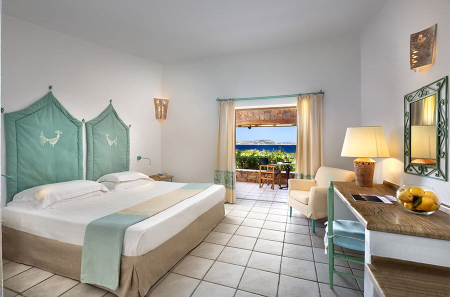 a bedroom with a large bed in a room