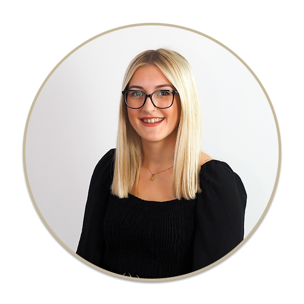 a woman standing in front of a mirror posing for the camera