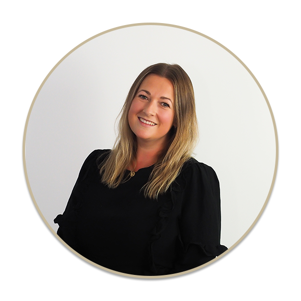 a woman standing in front of a mirror posing for the camera