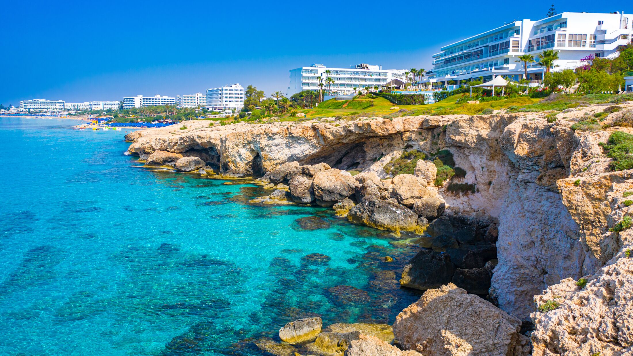 Cyprus. Ayia Napa Resort. Hotels off the coast. Blue Loguna in Cyprus. Rocky seashore. Relax in a resort hotel. Travels in Cyprus. Mediterranean Sea. Cavo Greco. Ayia Napa Resort Panorama.
