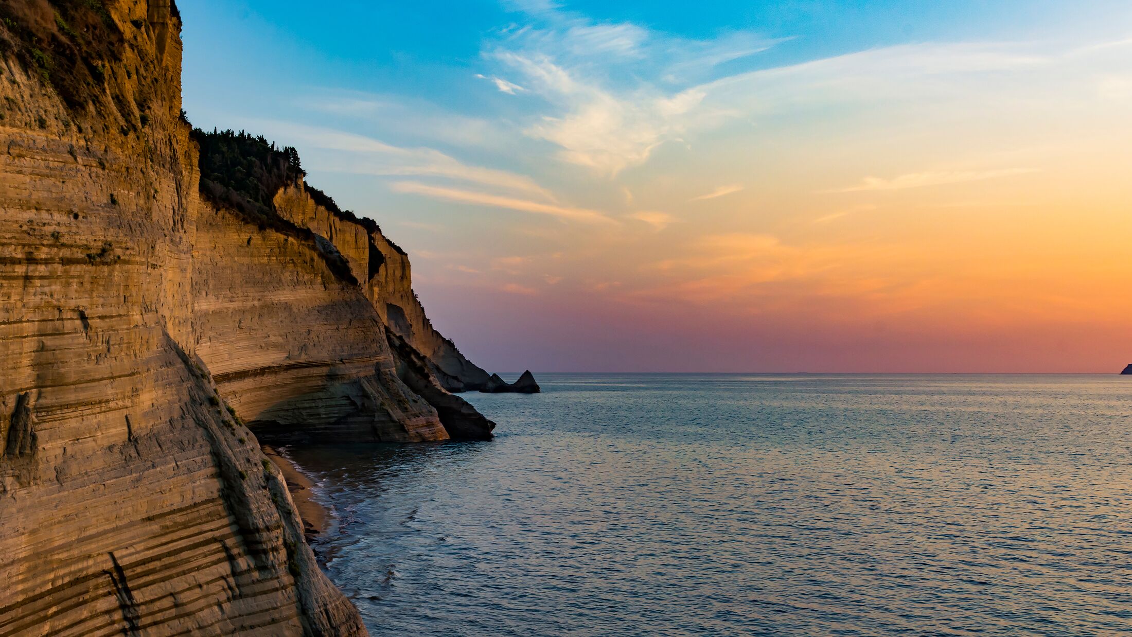 Sunset at Loggas beach in Corfu Greece.
