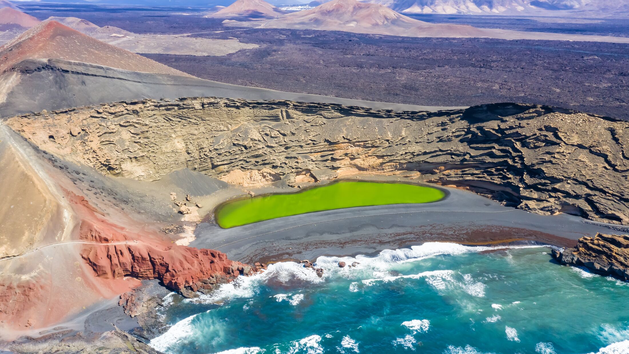 Green lake aerial view Charco de Los Clicos Verde near El Golfo on Lanzarote island travel on Canary Islands in Spain