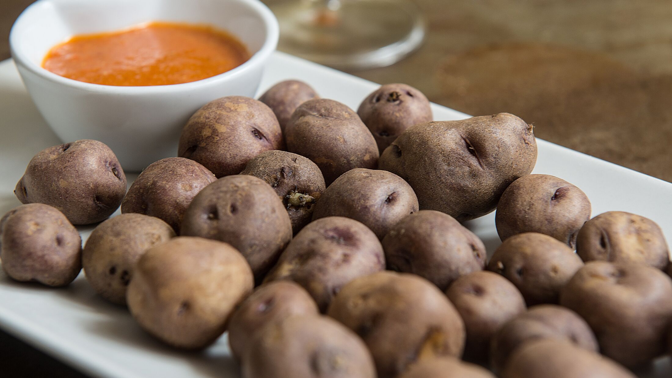 typical wrinkled potatoes with skin from the Canary Islands with their mojo