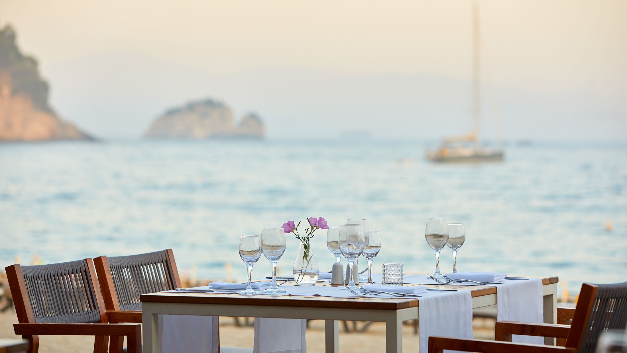 a chair sitting in front of a body of water