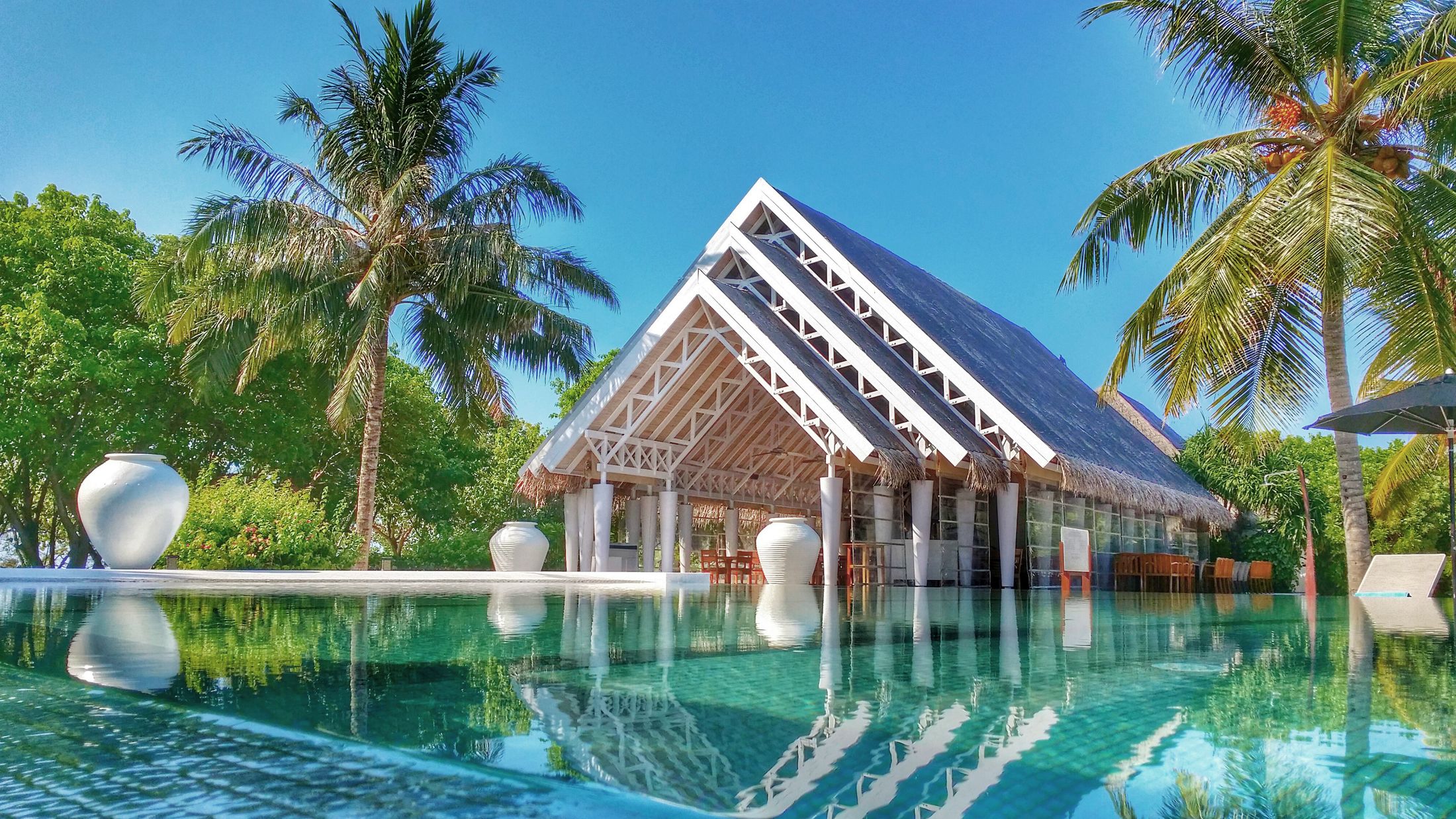 a large pool of water in front of a house