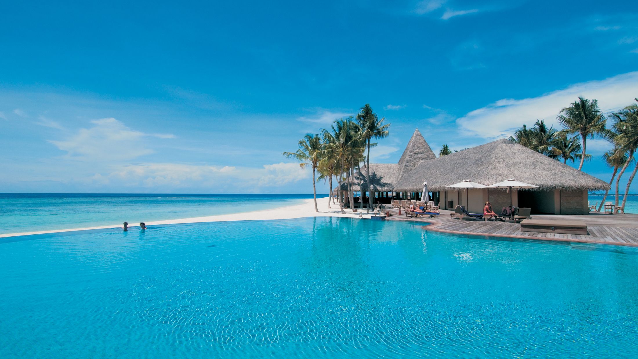 Swimming pool and bar area of Veligandu, Maldives.