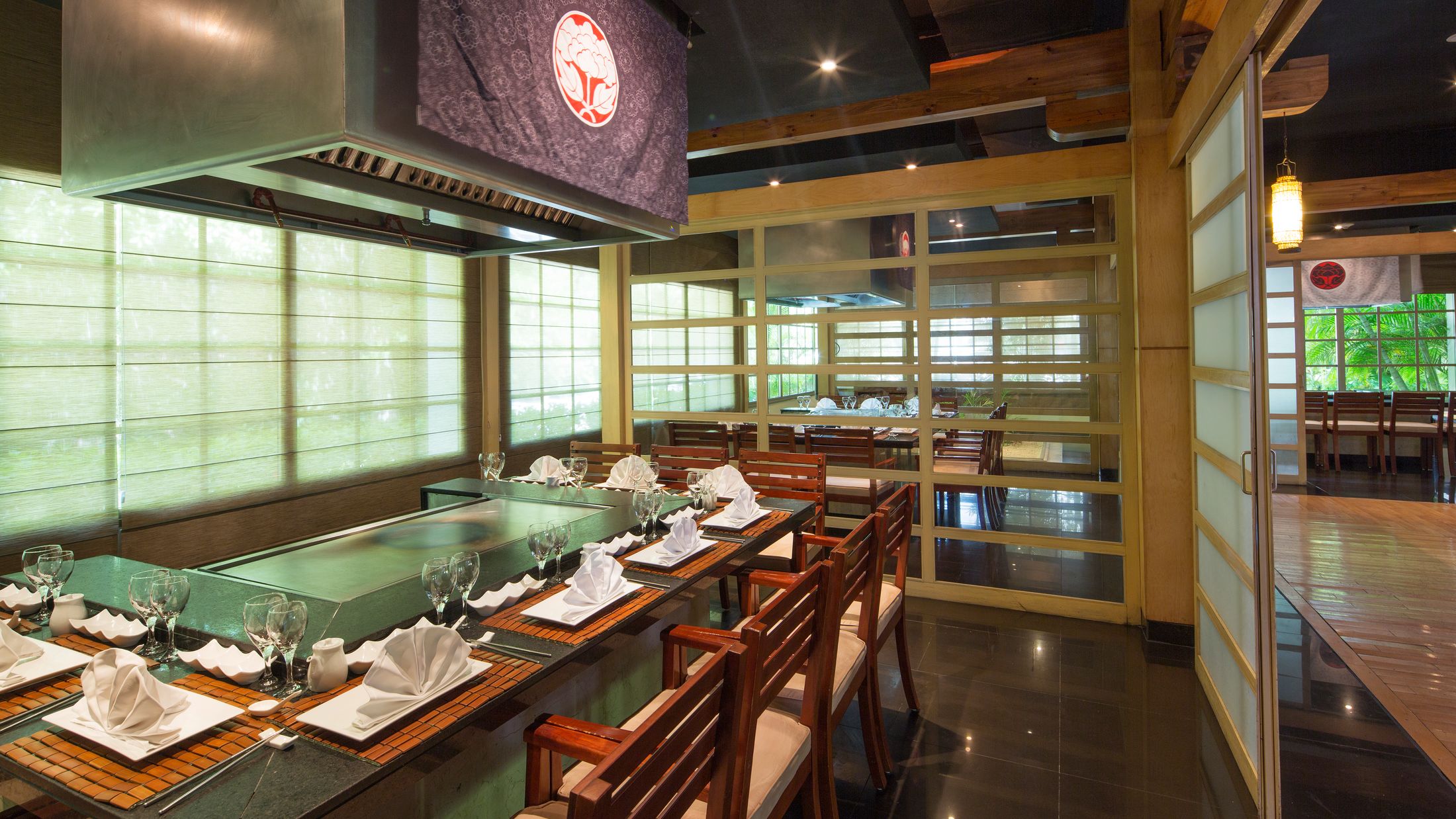 a kitchen with a table in a restaurant