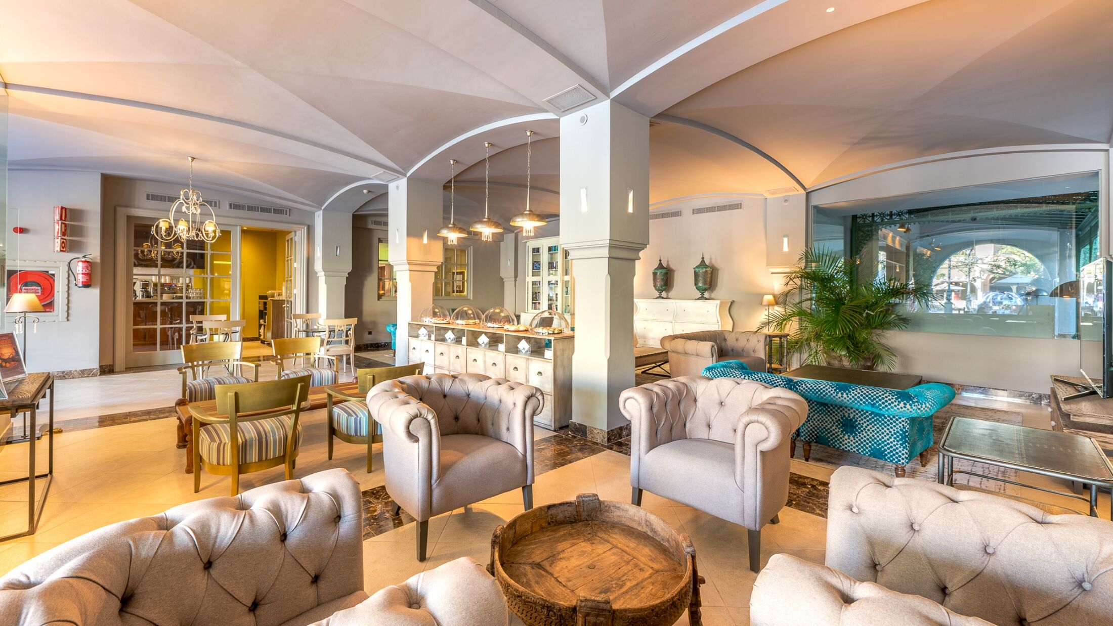 a living room filled with furniture and a fire place