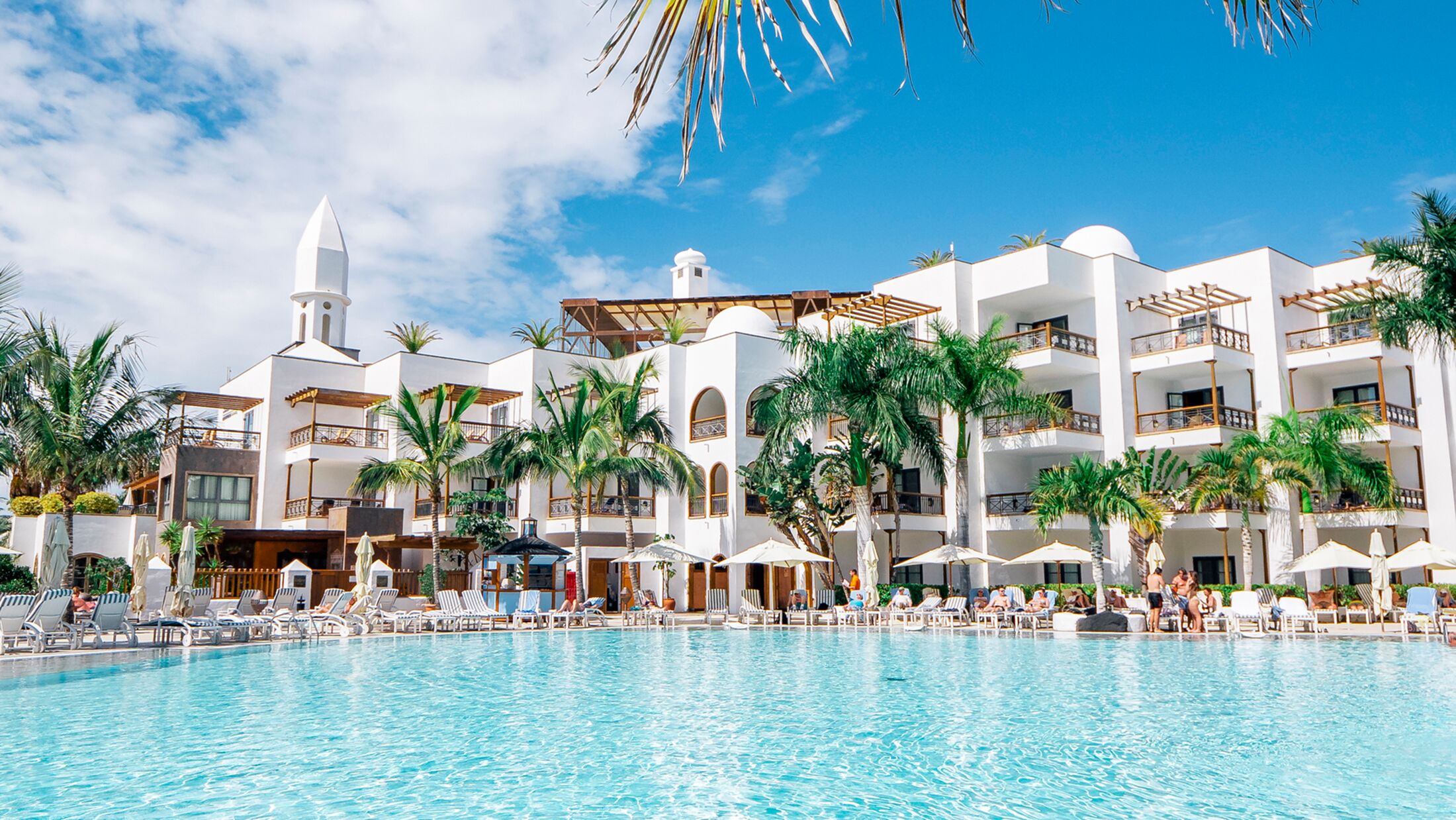 a large pool of water in front of a building