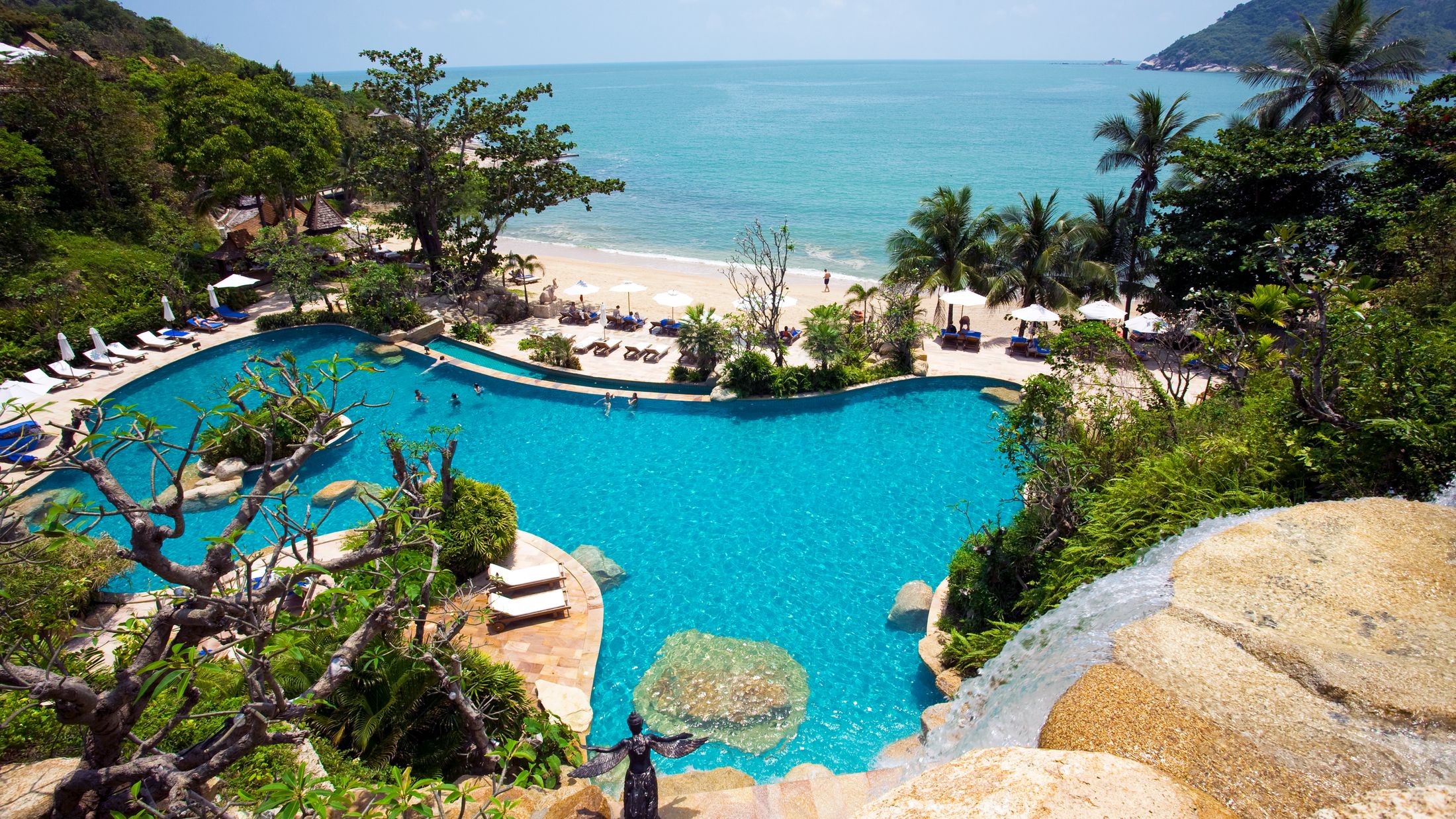 a pool next to a body of water