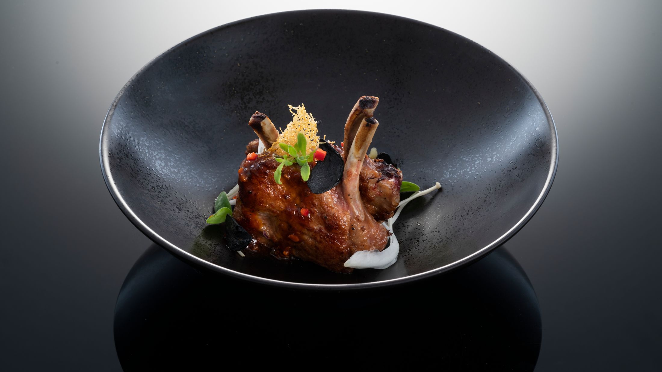 Hakkasan food shoot, Hakkasan Hanway Place. Wok-fry Australian lamb rack with black garlic: Dubai dish