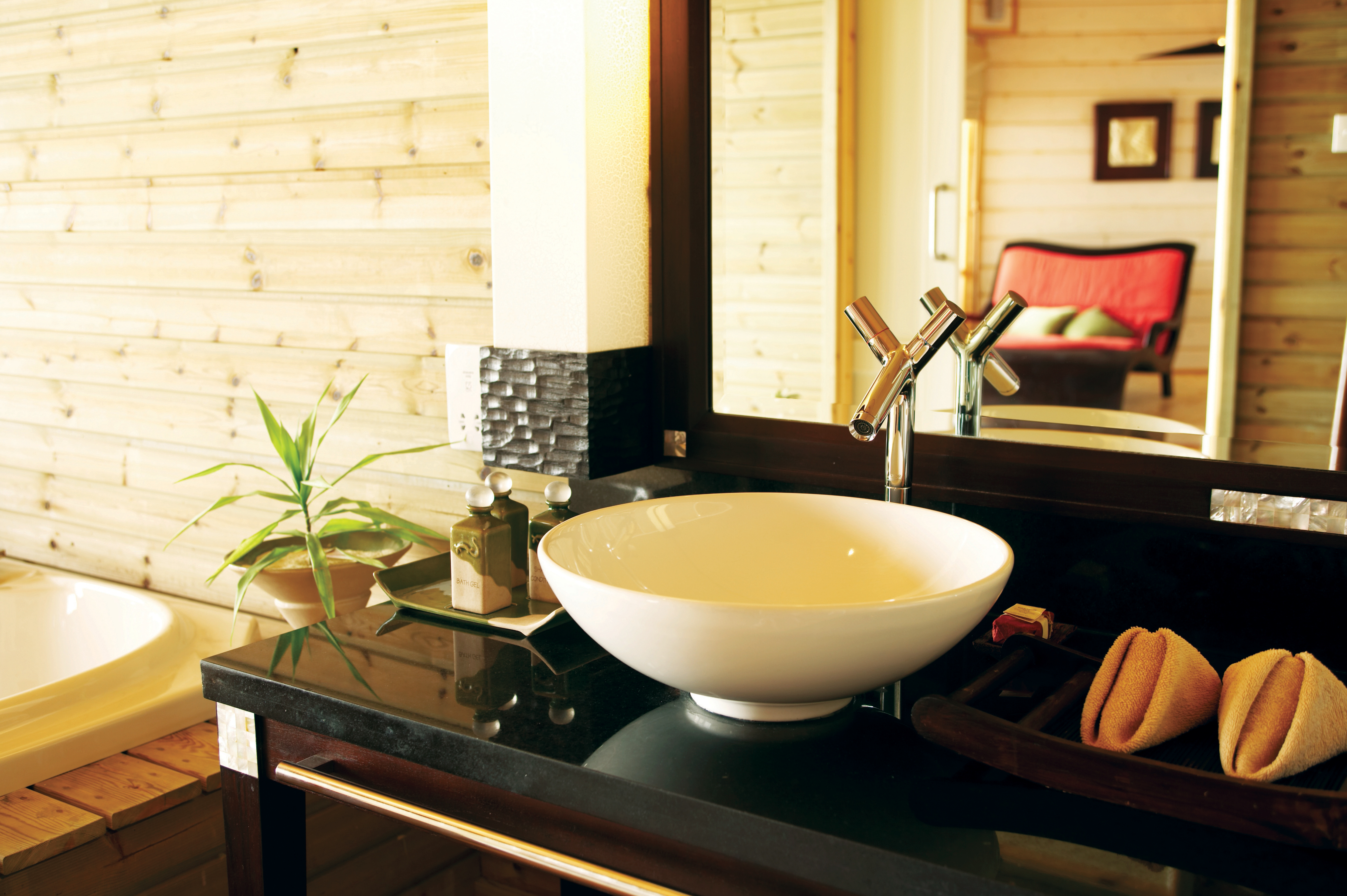 a white sink sitting under a window